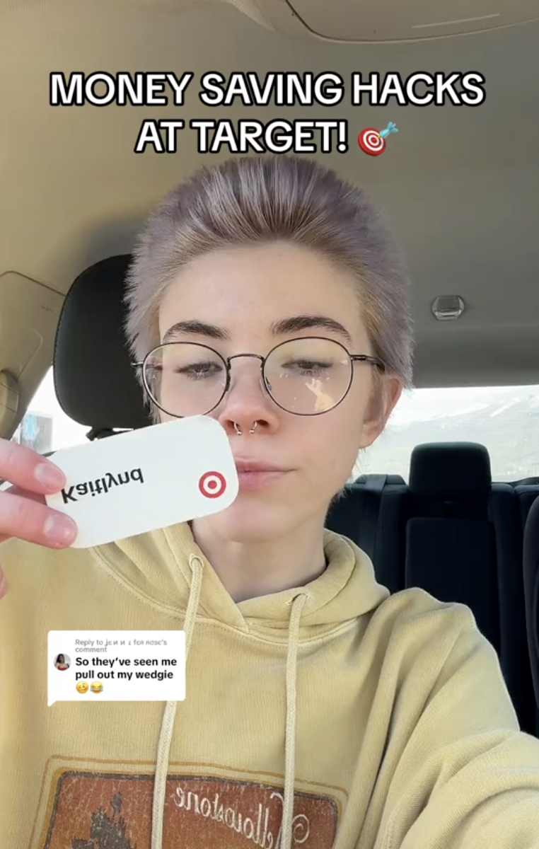 woman showing her target nametag